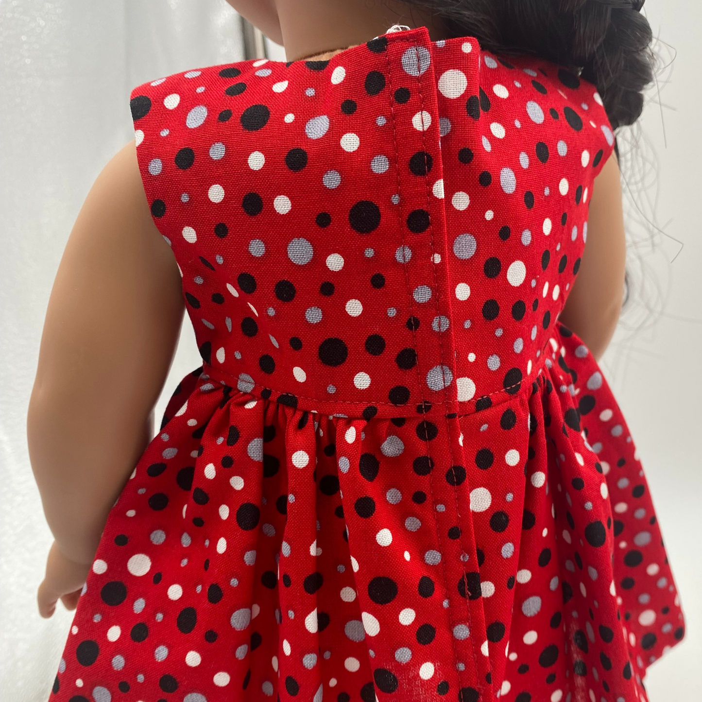 Red dress with silver, black and white dots